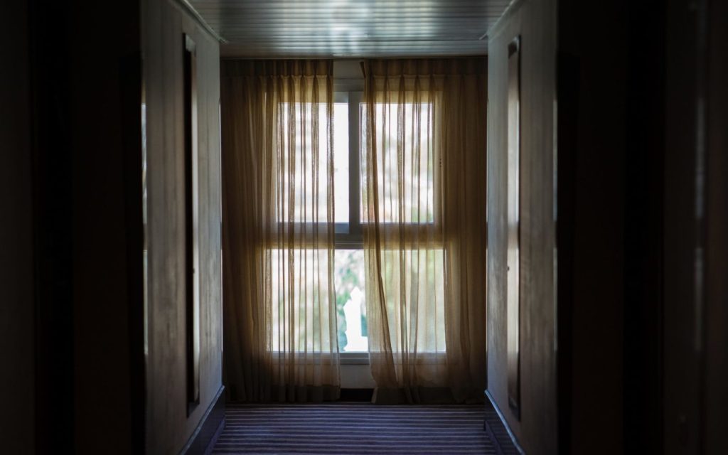 Image of a curtained window