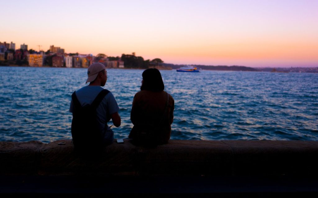 Friends talking on a beach