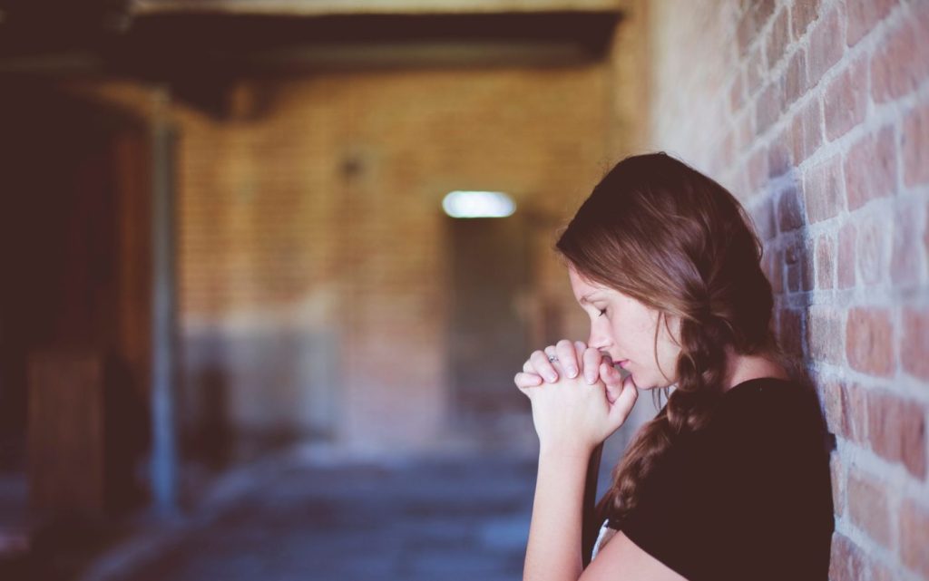 Young woman praying